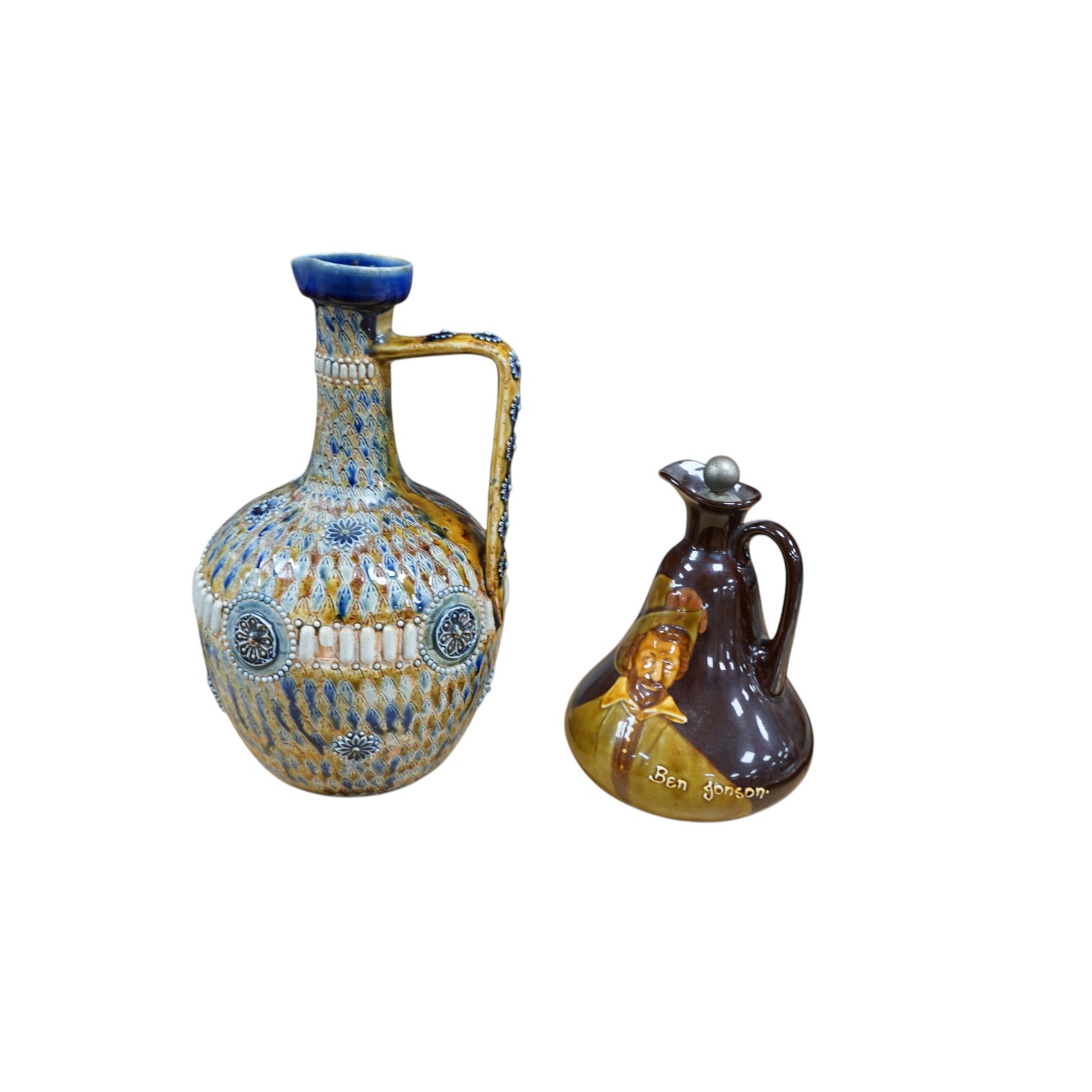 A Doulton Kingsware ewer and a Doulton stoneware jug, c.1882, tallest 29cm high. Condition - chip to Kingsware ewer lip and part of lozenge on body of jug missing, base of handle reglued and rim of jug crazed and split